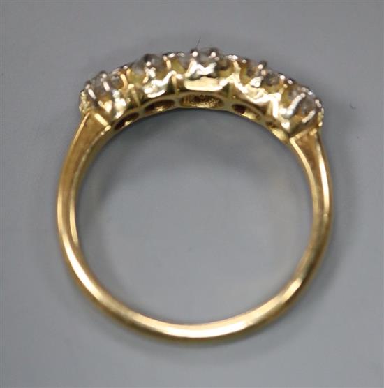 An 18ct gold and diamond five-stone ring, size L/M, gross 3 grams.